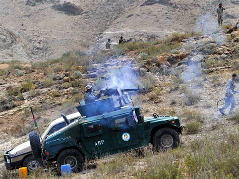 afghanistan taliban behead civilians torch homes in ghazni assault cbs news