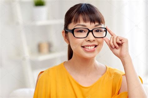 Happy Asian Young Woman In Glasses At Home — Stock Photo © Syda