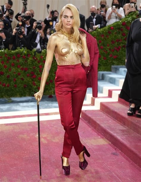Cara Delevingne Goes Topless And Dipped In Gold At MET Gala