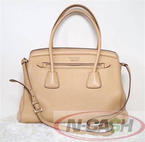 Perfectly sized for just your essentials, the accessory features an adjustable shoulder strap, a zip top fastening, an internal zipped. 58% OFF! Authentic Prada BN2571 Vitello Daino Bag | N-Cash