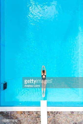 Aerial View Of Woman Diving Into Swimming Pool Photo Getty Images