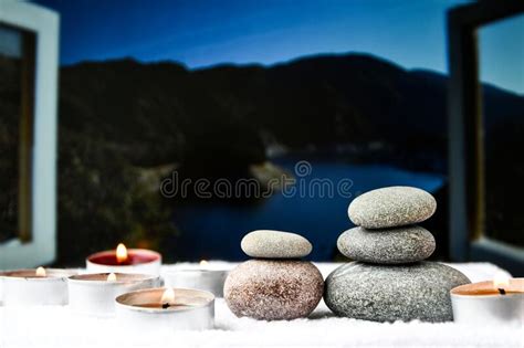 zen concept spa pebbles stones and burning aroma candles treatment aromatherapy and massage