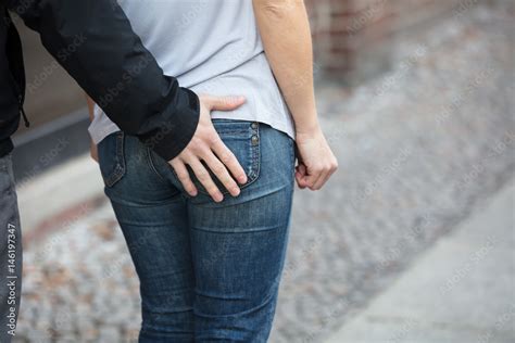 Man Touching Woman S Ass From Back Stock Photo Adobe Stock