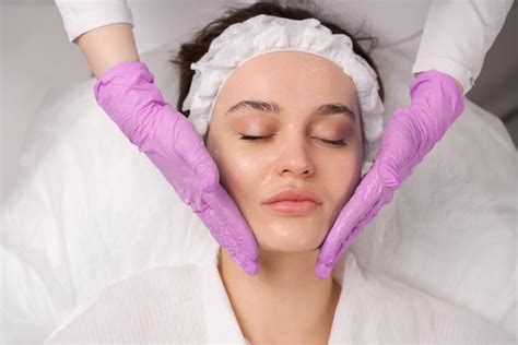 Premium Photo Facial Massage Beauty Treatment Closeup Of A Young