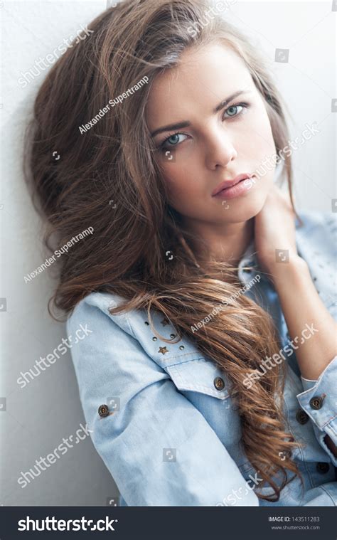 Portrait Of The Beautiful Young Girl With Long Brown Hair