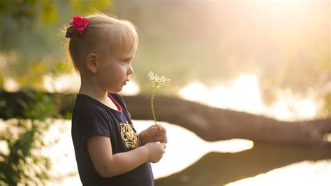 Little Girl Smelling A Flower In Nature Free Stock Video
