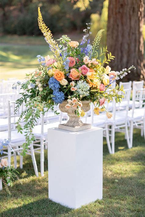 Colorful Aisle Flower Arrangement With Vase On Pedestal