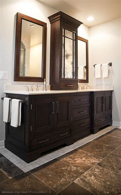 Countertop middle storage cabinet between vanities and framed mirrors. 25+ Most Stunning Bathroom Counter Storage Tower Designs ...