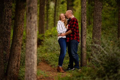 A Couple Share A Laugh Together In The Woods In Frisco Colorado