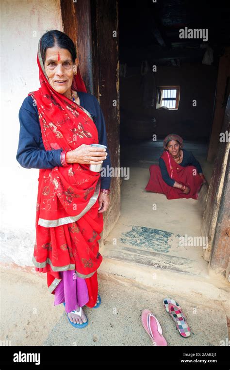 Indian Womans In Traditional Clothes Cleaning Their House At Kala Agar Village Uttarakhand