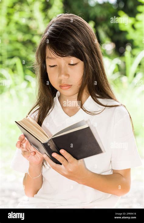Asian Girl Reading Book Stock Photo Alamy