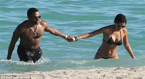 Maxwell Shows Off Impressive Torso As He Hits Beach With Bikini Clad
