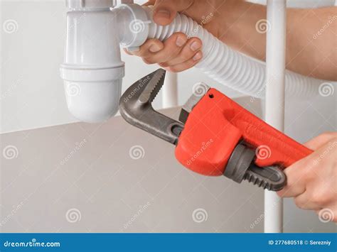 Plumber Repairing Pipes Of Kitchen Sink Closeup Stock Photo Image Of