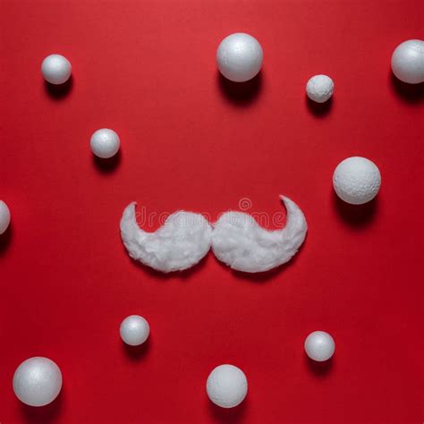 White Hipster Mustache Of Santa Claus On Red Background Stock Image