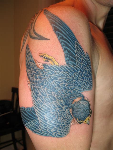 Amazing unique falcon tattoo design. YatesTattoo: Peregrine Falcon and Falconer