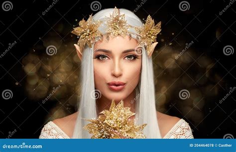 Attractive Elf Queen With Golden Christmas Poinsettia Flower In