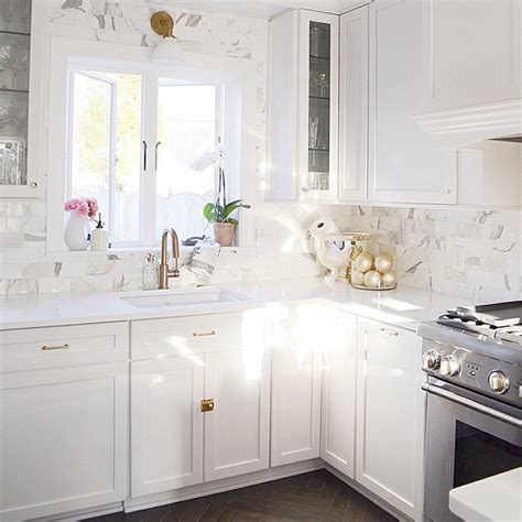 White Shaker Cabinets With White Marble Subway Tiles Transitional