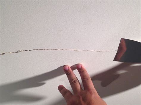 Begin by laying down plastic and scraping away any loose paper or debris from the drywall, and then apply a single 1 cleaning and taping a ceiling crack. Superficial Drywall Ceiling Crack Repair - iFixit Repair Guide