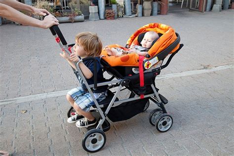 Joovy Caboose Stand On Tandem Stroller With Car Seater Baby