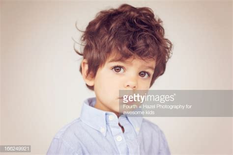 Brown Eyed Boy With Curly Hair High Res Stock Photo