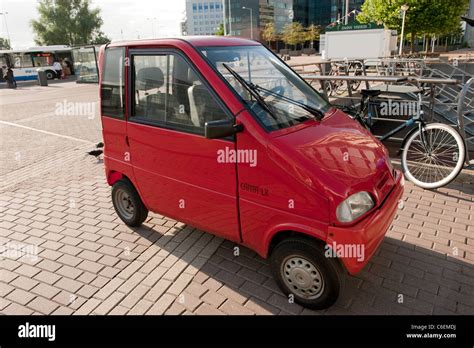 Small Red Disabled Car Amsterdam Holland Netherlands Europe Stock Photo