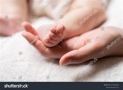 Asian Babys Leg Mothers Hand Stock Photo 2174092569 Shutterstock