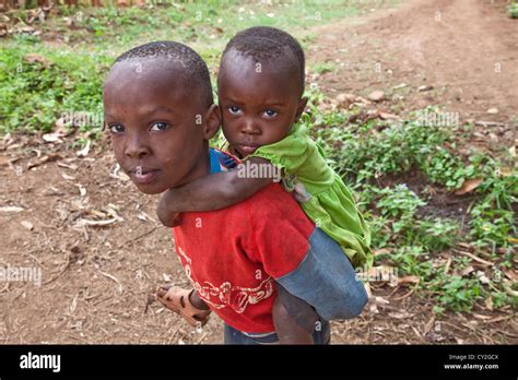 Two African Orphan Children Brother And Sisterplaying On The Street