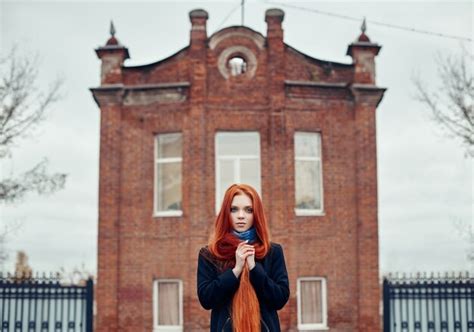 Premium Photo Woman With Long Red Hair Walks In Autumn On Street