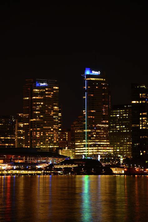 Beautiful Night Scene Of Port Vancouver With Tall Building Background