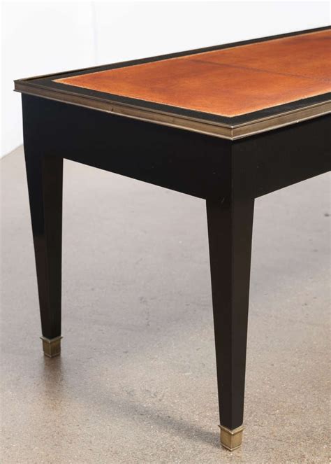 You can get your hands on simple metal. French Directoire Leather-Top Coffee Table at 1stdibs
