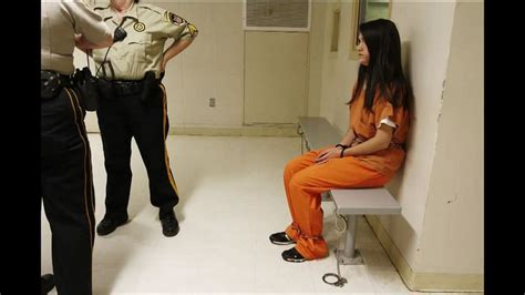 woman in full shackles chains and handcuffs waits to get to the court press photo high