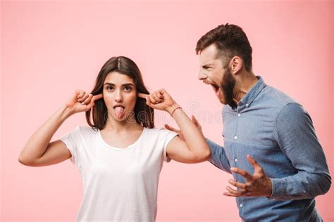 Portrait Of An Angry Young Couple Having An Argument Stock Photo