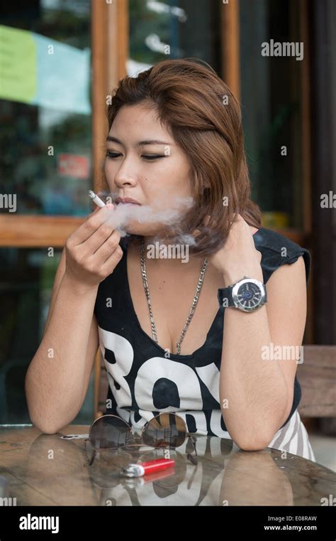 Young Asian Woman Smoking Cigarette Outside Coffee Shop Stock Photo Alamy