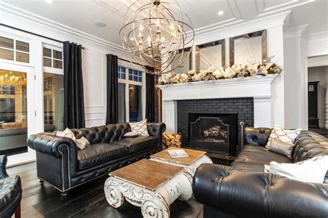 High ceiling living room framed with black metal beams showcases white brick pillars. 23+ Black Living Room Couches, Designs, Ideas, Plans ...