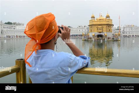 Amritsar India Jul 25 2015 A Young Man Taking Photos At The Golden