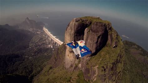 Composed of granite and gneiss, its elevation is 844 meters (2,769 ft), making it one of the highest mountains in the world that ends directly in the ocean. Wingsuit gliding over Pedra da Gávea in Rio de Janeiro - YouTube