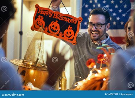 Man Enjoying A Halloween Party People In Costume Celebrate Together A