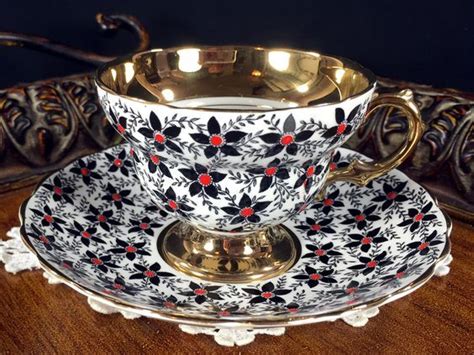 Decorative arts > ceramics & porcelain > cups & saucers. Rosina Black Floral Chintz Teacup and Saucer, Gold Banded ...