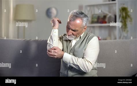 Elderly Male Suffering Pain In Elbow Rheumatism Disease Painful Old