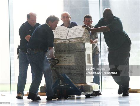 Workers Move The Ten Commandments Monument From The Rotunda Of The