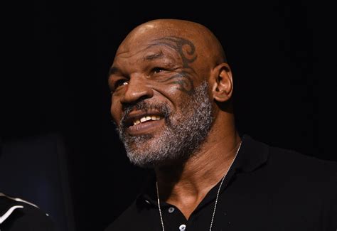 Watch Mike Tyson Feeds Co Passenger On Plane Multiple Punches The