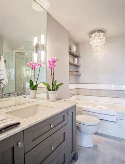 Best bathroom vanities for small bathrooms according to our research. Andrea: light fixture, dark gray cabinet with light gray ...