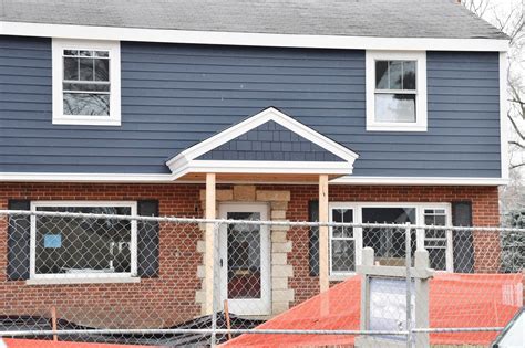 Picking Blue Exterior Siding With A Red Brick Home Red Brick House