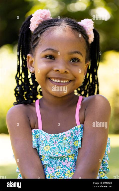 Closeup Portrait Of Smiling African American Cute Girl With Dreadlocks