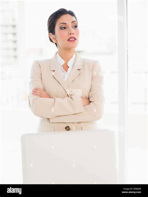 Stern Businesswoman Standing Behind Her Chair Stock Photo Alamy