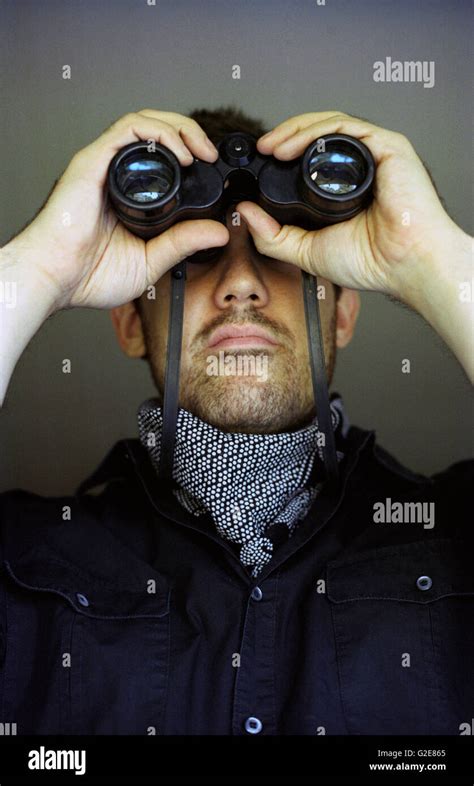 Man Looking Through Binoculars Stock Photo Alamy