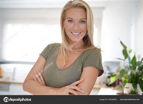 Portrait Beautiful Middle Aged Blond Woman Stock Photo By ©goodluz