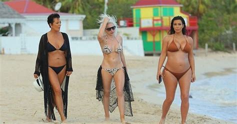 kris jenner shows off her incredible bikini body in black two piece kim kardashian daughters