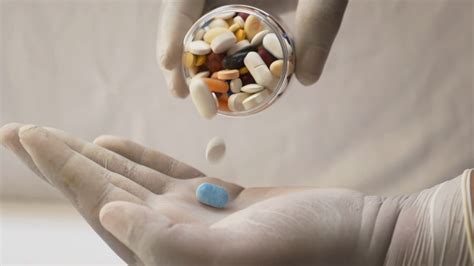 Pills Or Capsules Being Poured Into Hand In Slow Motion Stock Video
