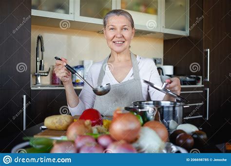Mature Woman In Kitchen Preparing Food Stock Image Image Of Food